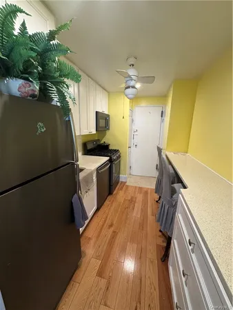 a kitchen with a refrigerator a sink and dishwasher