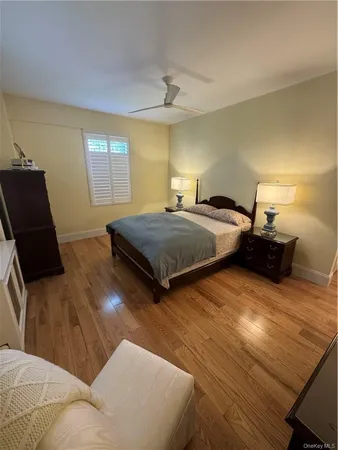 a bedroom with two beds and a couch