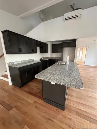 a view of hallway with wooden floor