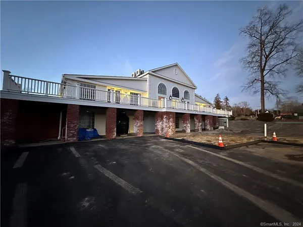 a view of a white building from a balcony