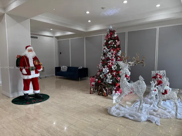 a room with a table chairs and wooden floor