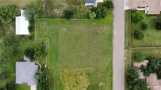 an aerial view of residential house with outdoor space and lake view