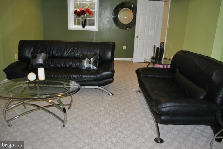 15317 Peach Orchard Road Silver Spring, MD 20905 - Photo 25 of 30 a living room with furniture