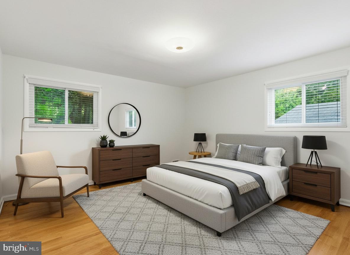 1454 Roxanna Road Northwest Washington, DC 20012 - Photo 17 of 48 a bedroom with a bed a table chair and a window
