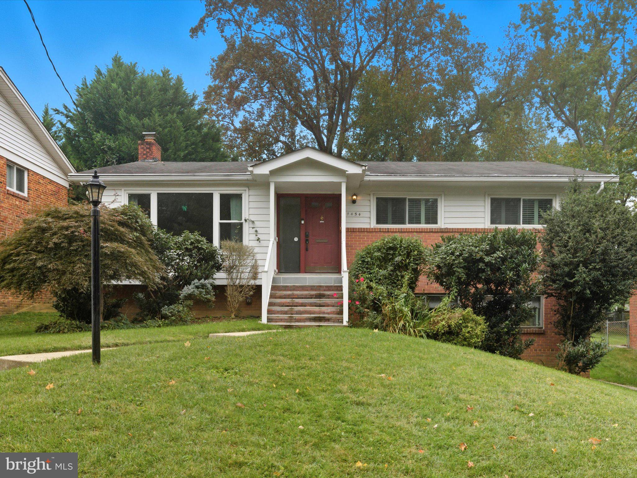 1454 Roxanna Road Northwest Washington, DC 20012 - Photo 2 of 48 front view of house with a yard