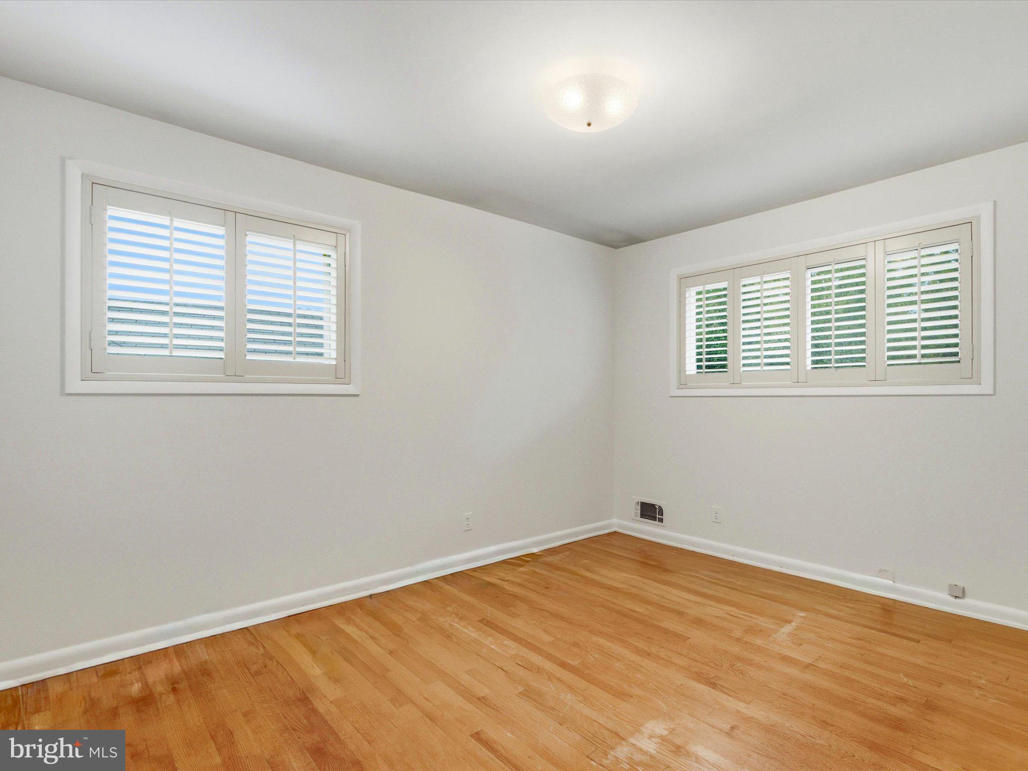 1454 Roxanna Road Northwest Washington, DC 20012 - Photo 22 of 48 a view of empty room with wooden floor