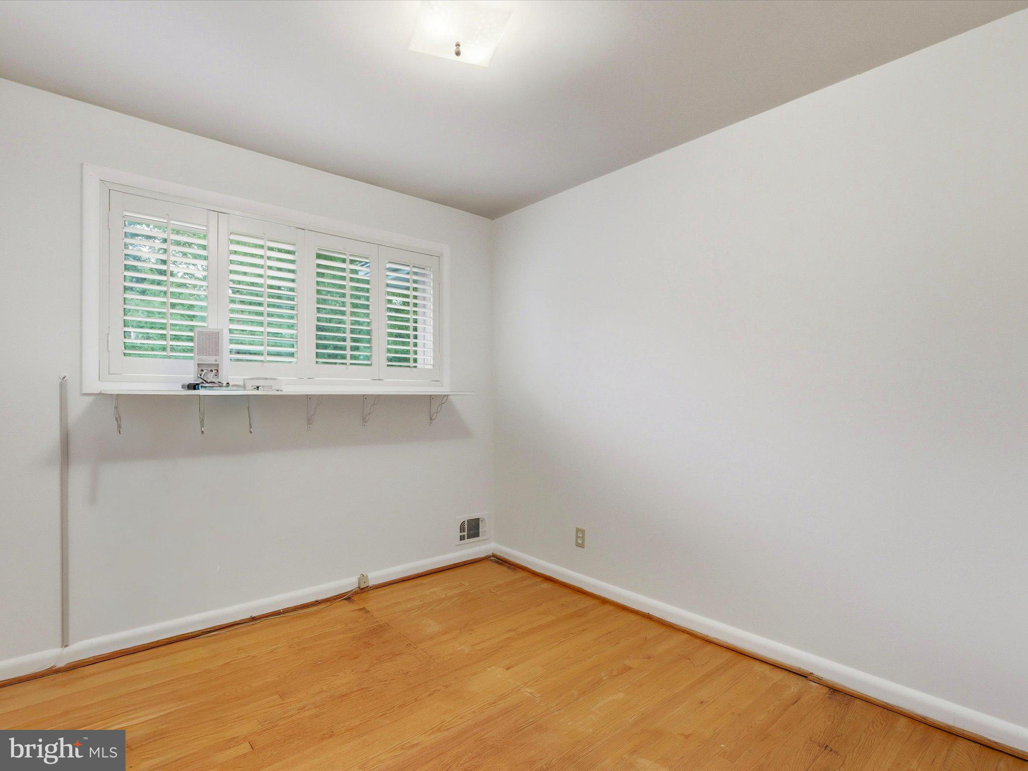 1454 Roxanna Road Northwest Washington, DC 20012 - Photo 25 of 48 an empty room with a window