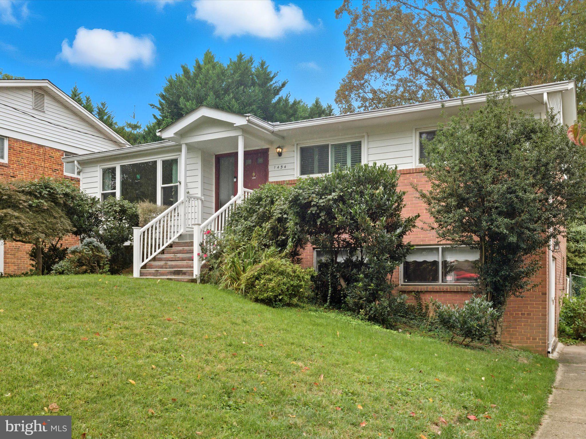 1454 Roxanna Road Northwest Washington, DC 20012 - Photo 3 of 48 a front view of house with yard and green space