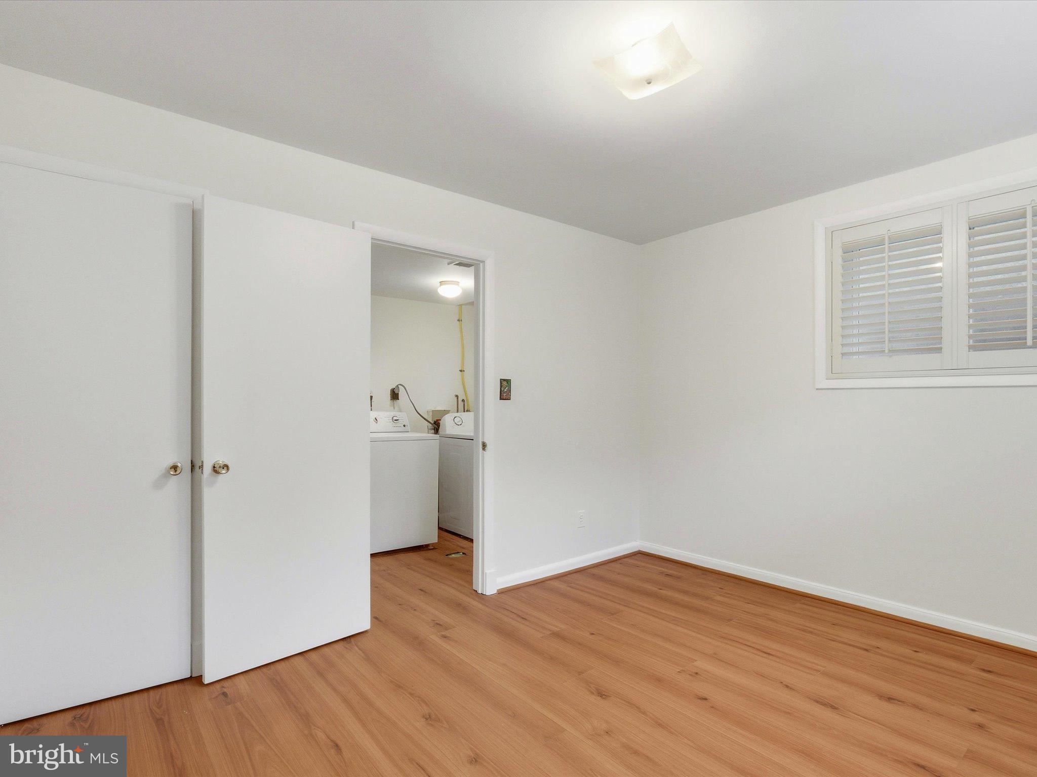 1454 Roxanna Road Northwest Washington, DC 20012 - Photo 33 of 48 wooden floor in an empty room