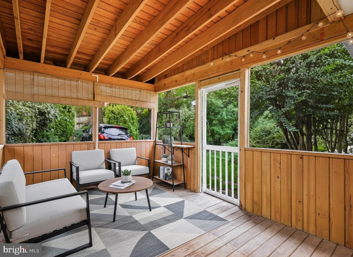 1454 Roxanna Road Northwest Washington, DC 20012 - Photo 39 of 48 a balcony with furniture and wooden floor