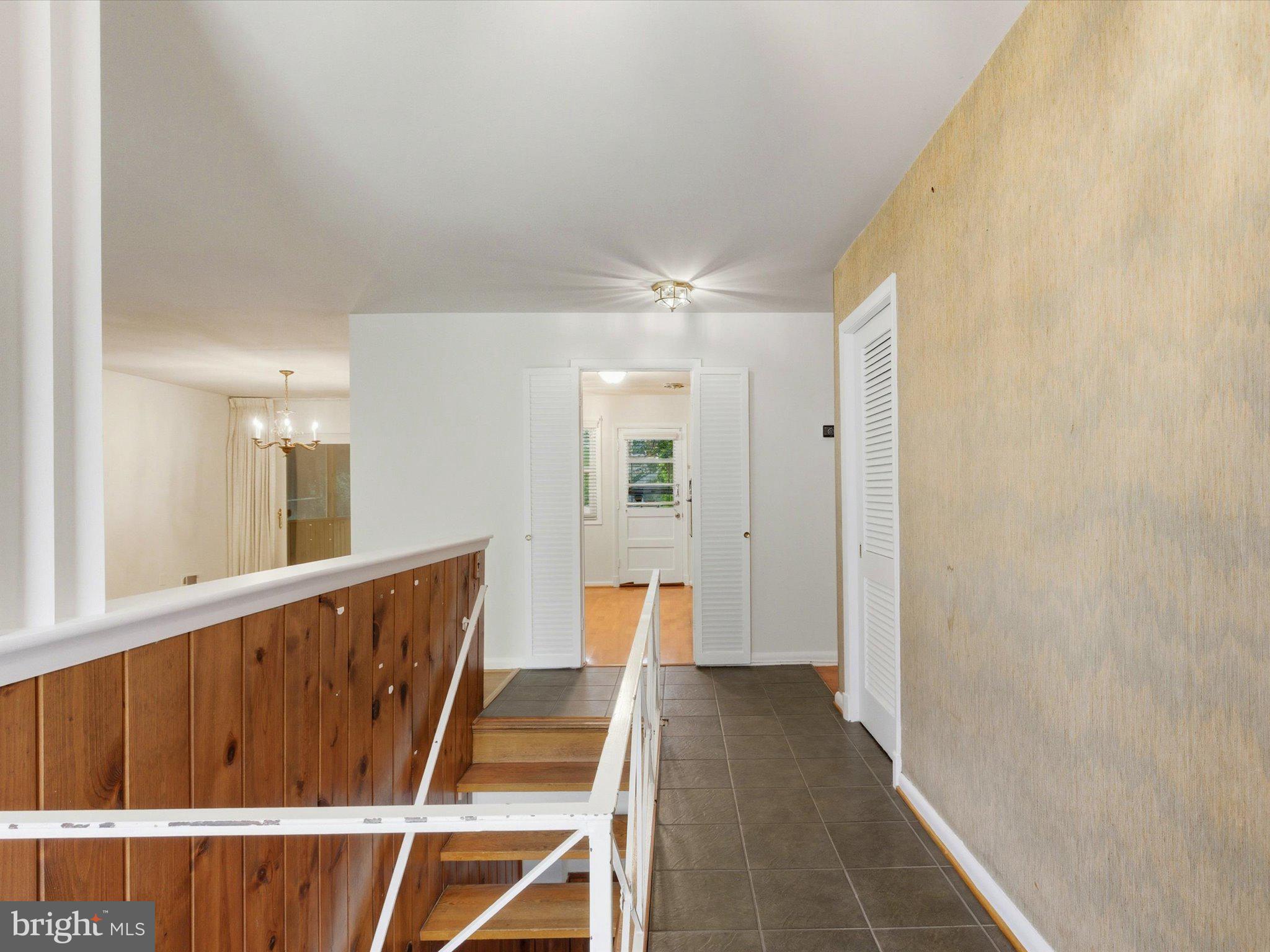 1454 Roxanna Road Northwest Washington, DC 20012 - Photo 4 of 48 a view of a hallway with wooden floor and staircase