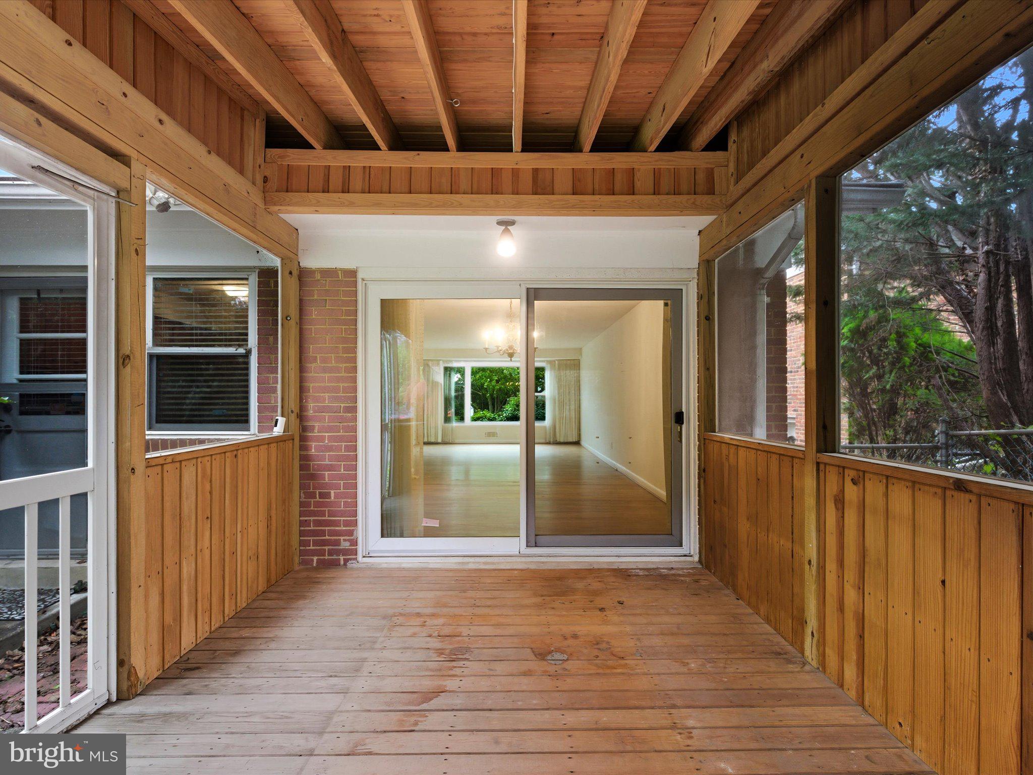1454 Roxanna Road Northwest Washington, DC 20012 - Photo 41 of 48 a view of a porch with wooden floor and stairs