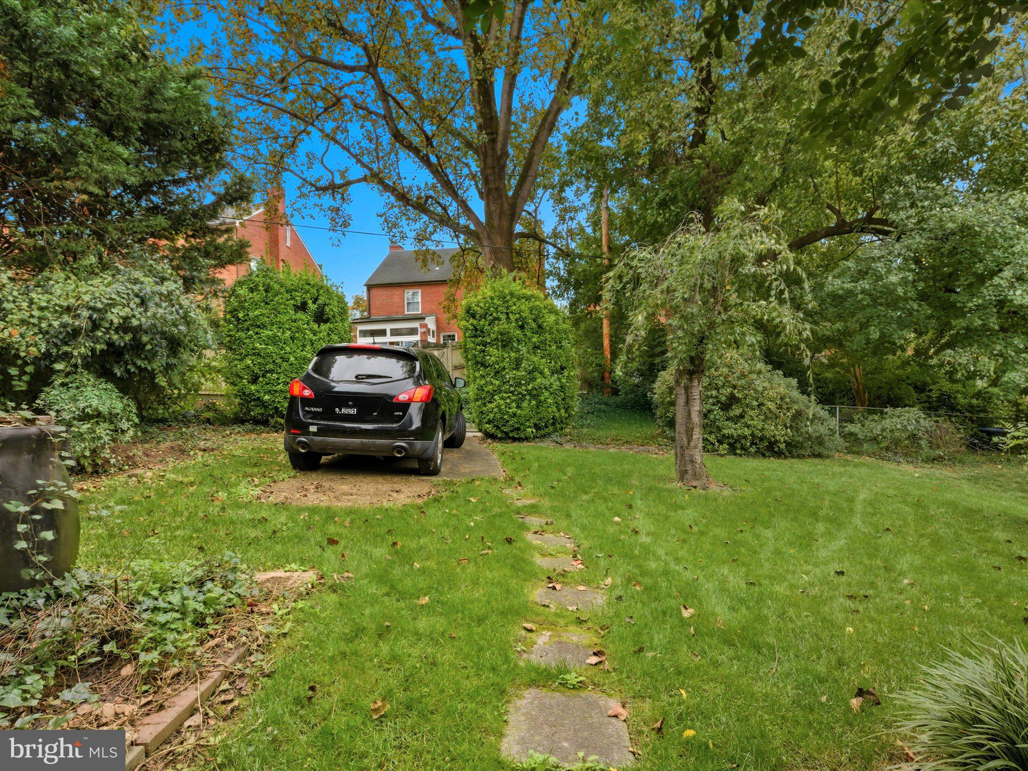 1454 Roxanna Road Northwest Washington, DC 20012 - Photo 42 of 48 a car parked in the middle of a forest