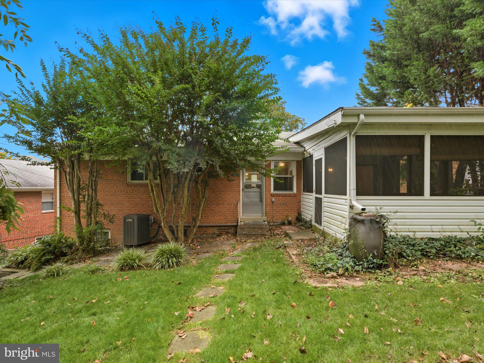 1454 Roxanna Road Northwest Washington, DC 20012 - Photo 43 of 48 a front view of a house with garden