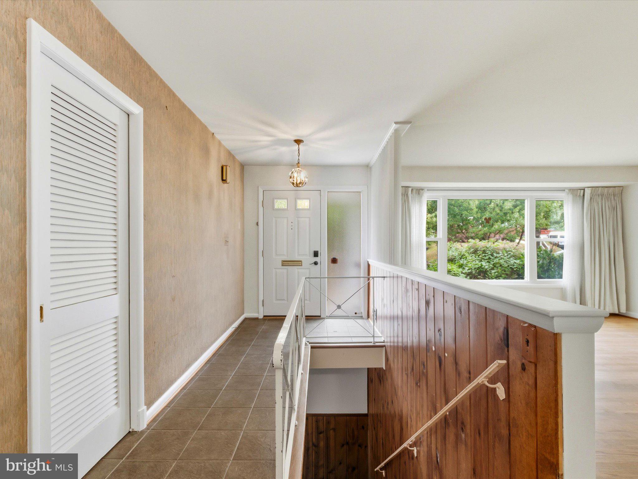 1454 Roxanna Road Northwest Washington, DC 20012 - Photo 5 of 48 a view of a hallway with wooden floor and staircase