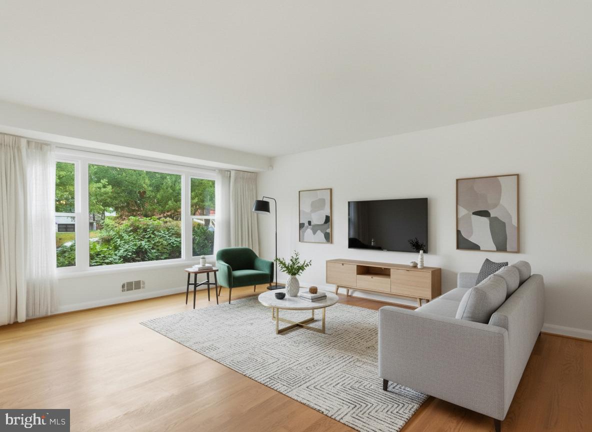 1454 Roxanna Road Northwest Washington, DC 20012 - Photo 6 of 48 a living room with furniture and a flat screen tv