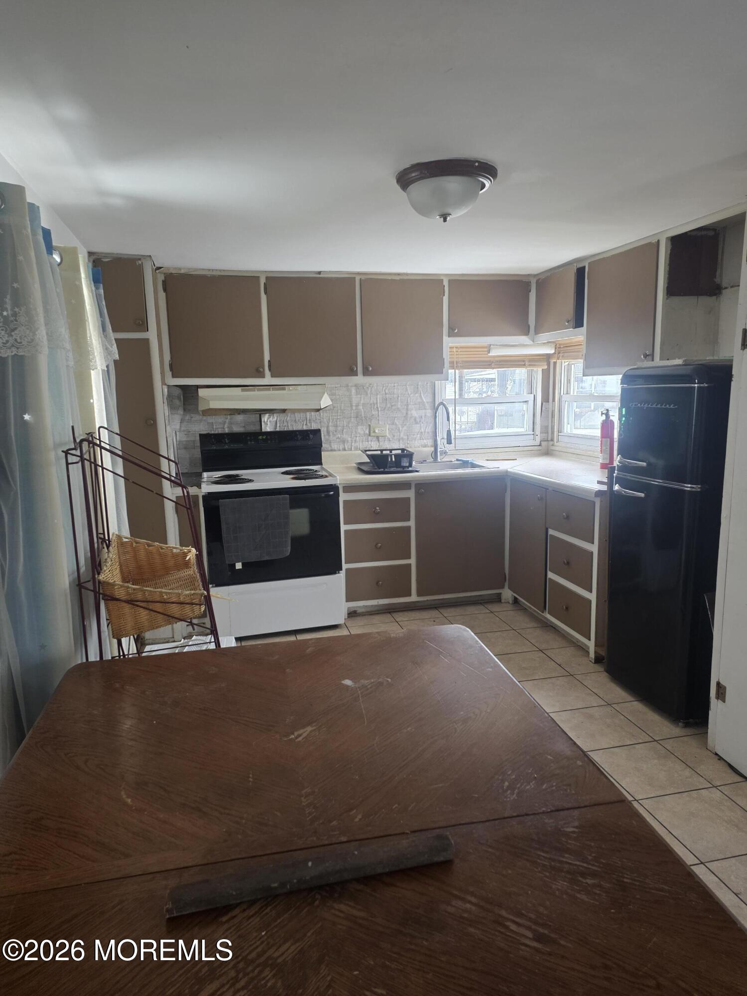 45 Locust Grove Hazlet, NJ 07730 - Photo 6 of 14 a kitchen with stainless steel appliances granite countertop a refrigerator a stove and a sink