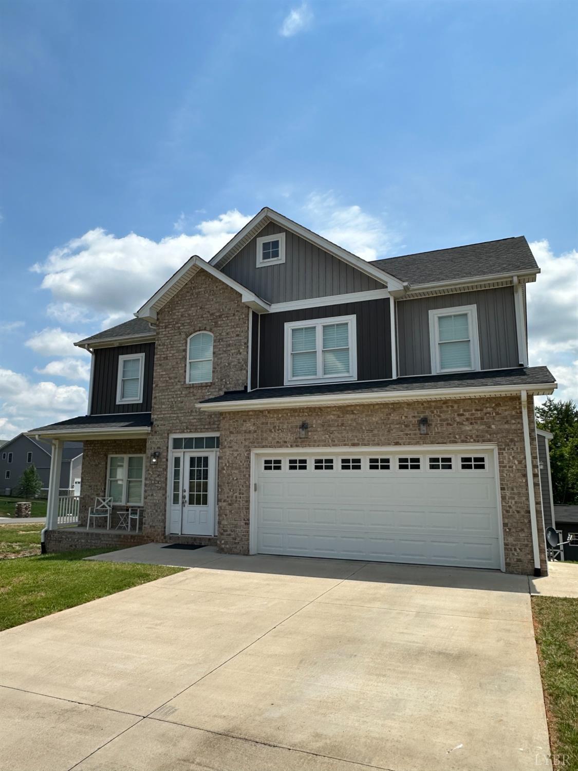 193 Turning Point Drive Evington, VA 24550 - Photo 3 of 6 a front view of a house with a yard
