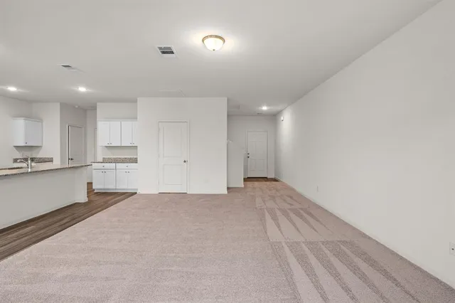 a large kitchen with cabinets