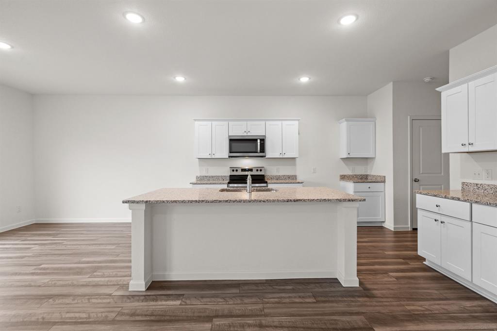 619 Colgate Circle Princeton, TX 75407 - Photo 15 of 31 a large kitchen with cabinets