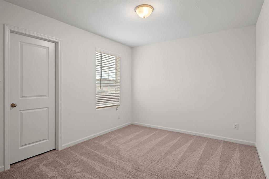 619 Colgate Circle Princeton, TX 75407 - Photo 20 of 31 an empty room with a window