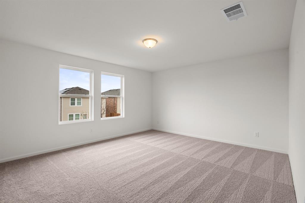 619 Colgate Circle Princeton, TX 75407 - Photo 27 of 31 an empty room with windows