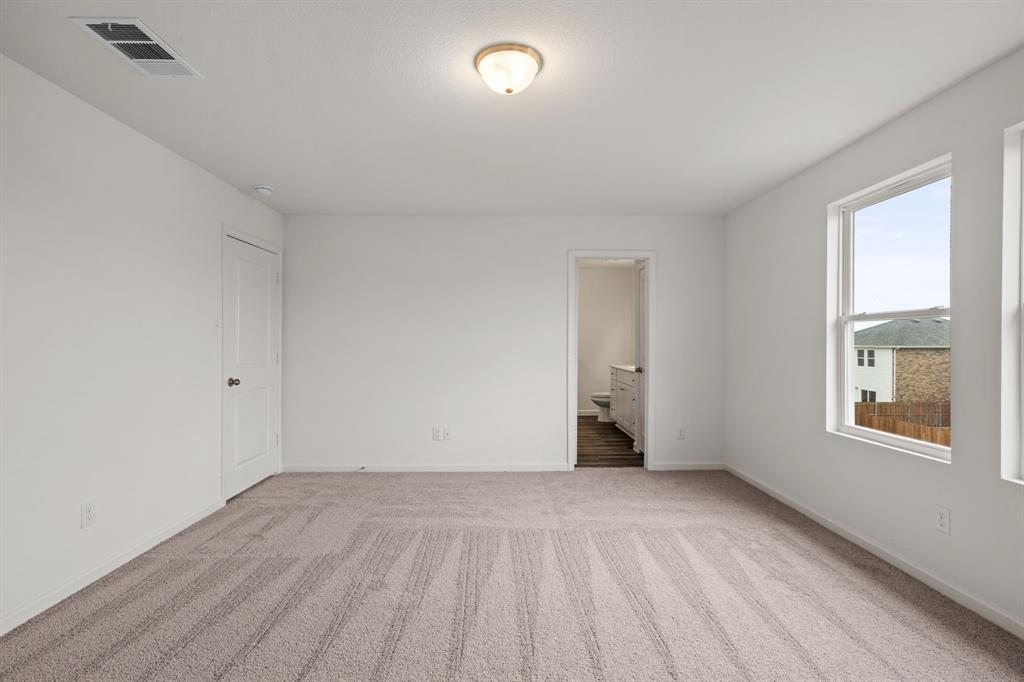 619 Colgate Circle Princeton, TX 75407 - Photo 28 of 31 wooden floor in an empty room with a window