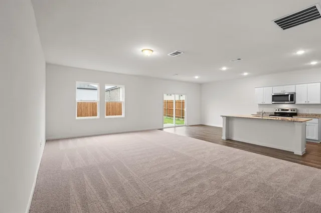 a view of kitchen with wooden floor