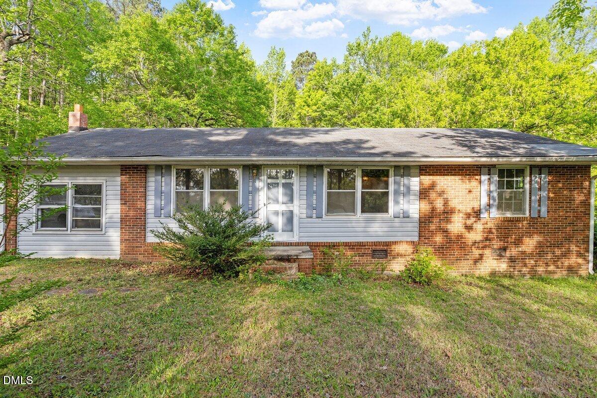 122 Richmond Road Mebane, NC 27302 - Photo 1 of 17 a house view with a garden space