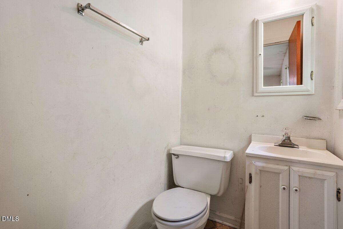 122 Richmond Road Mebane, NC 27302 - Photo 14 of 17 a white toilet sitting next to a bathroom sink