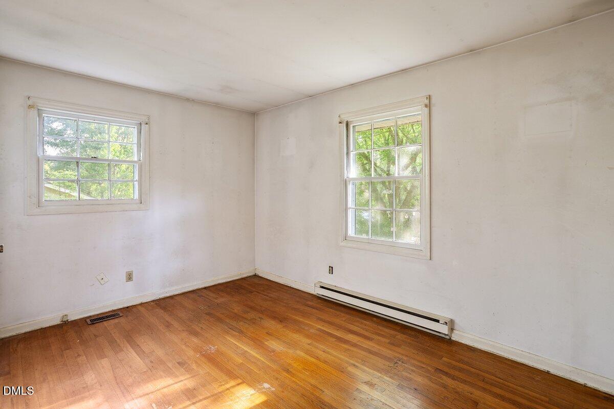 122 Richmond Road Mebane, NC 27302 - Photo 15 of 17 a view of a room with wooden floor and windows