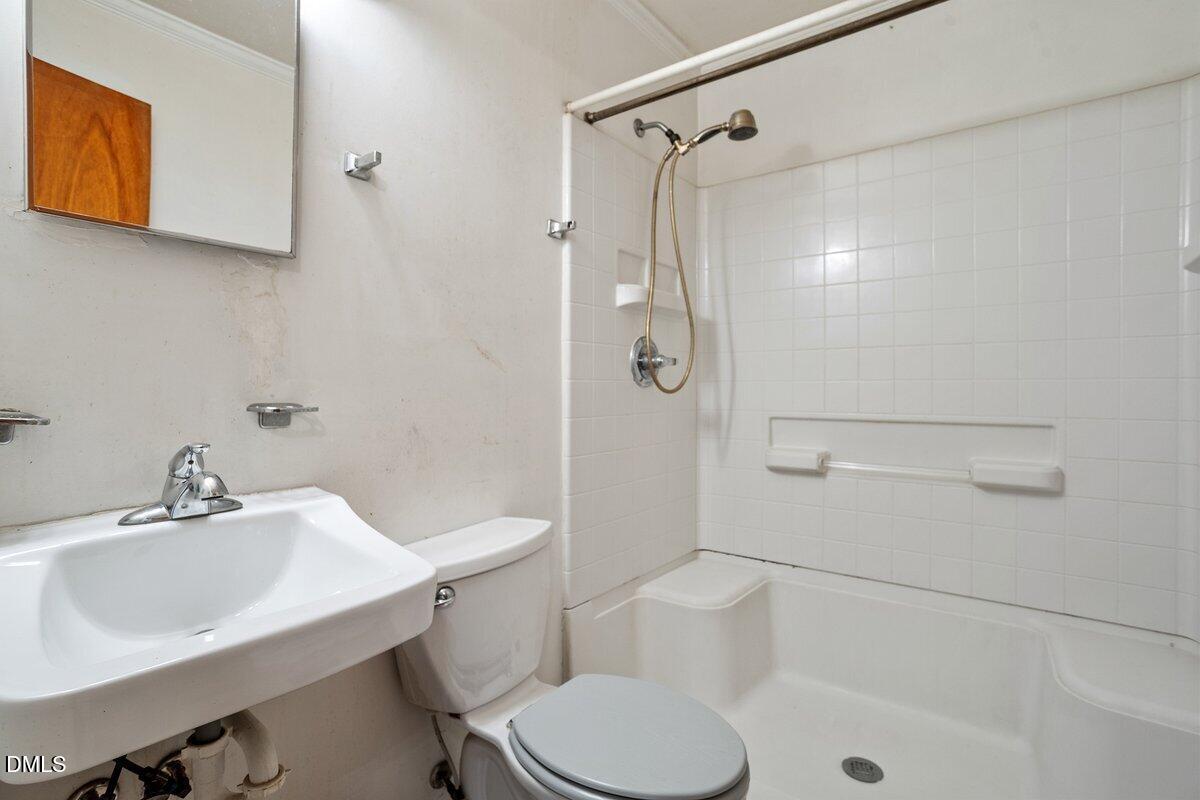 122 Richmond Road Mebane, NC 27302 - Photo 16 of 17 a bathroom with a sink toilet and shower