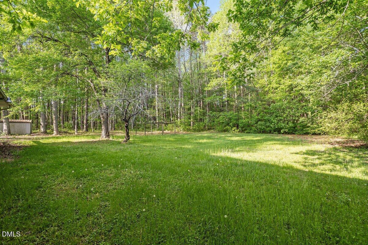 122 Richmond Road Mebane, NC 27302 - Photo 5 of 17 a view of outdoor space with garden