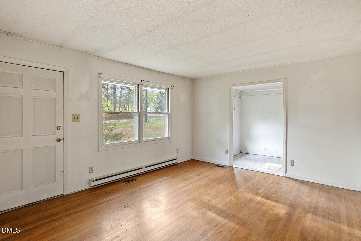 122 Richmond Road Mebane, NC 27302 - Photo 7 of 17 an empty room with windows