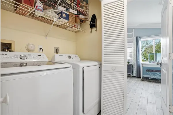 a utility room with dryer and washer