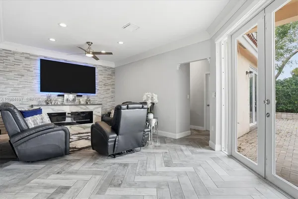 a living room with furniture and a flat screen tv