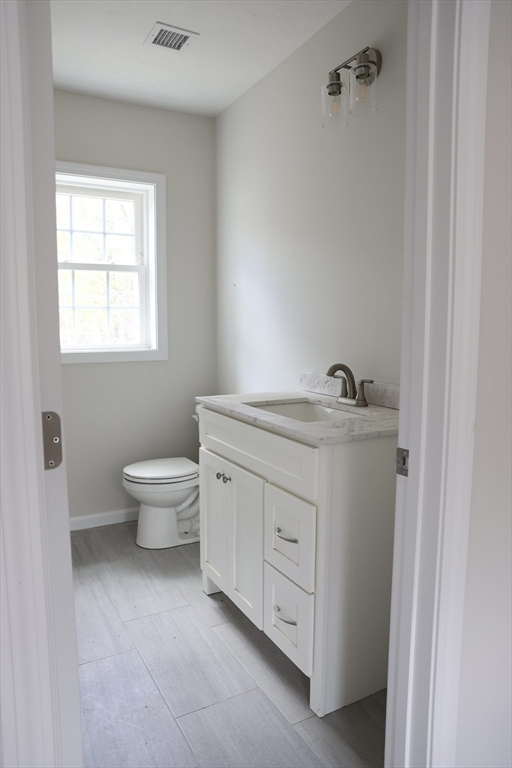 1 A Dudley Road Townsend, MA 01469 - Photo 9 of 17 a room with a white bed and a dresser