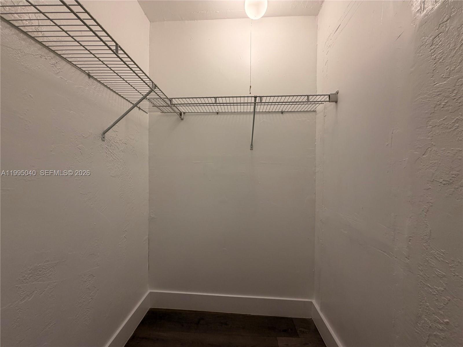 143 Southwest 9th Street, Unit 310 Miami, FL 33130 - Photo 9 of 20 a view of small space with racks on the wall