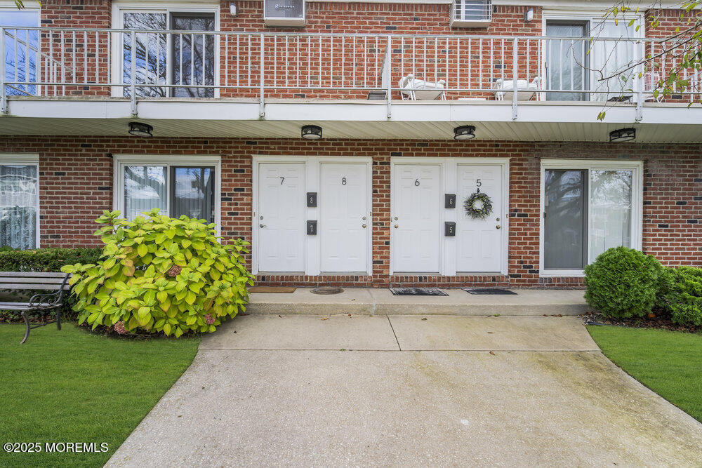 114 3rd Avenue, Unit 8 Belmar, NJ 07719 - Photo 1 of 13 a view of a house with a garden