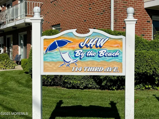 a sign that is on a brick wall