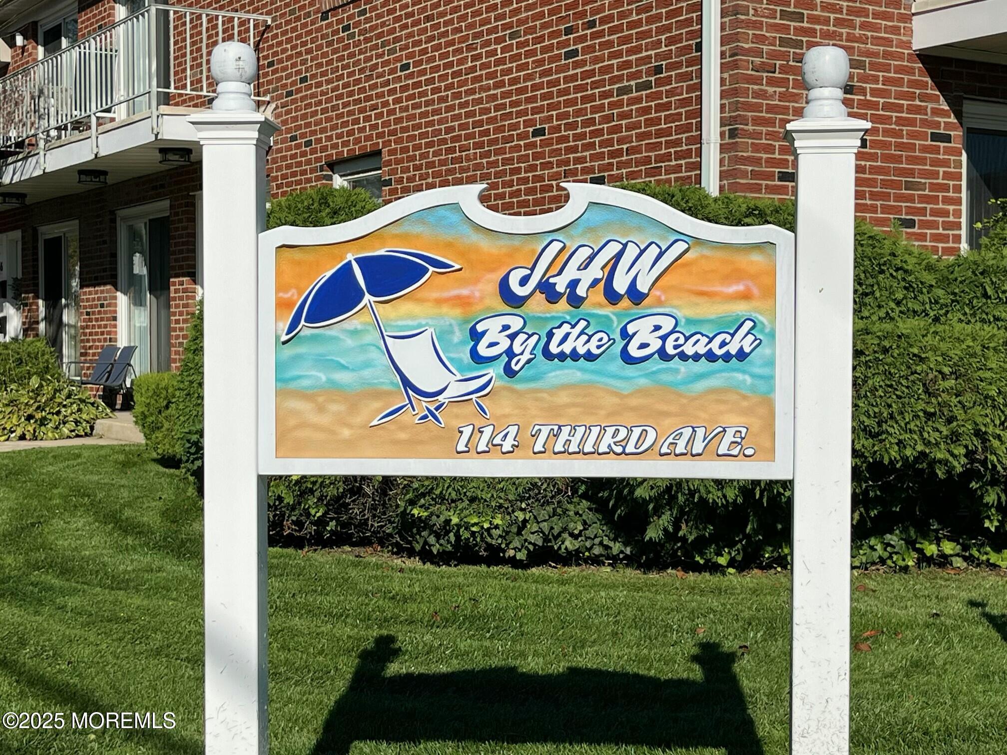 114 3rd Avenue, Unit 8 Belmar, NJ 07719 - Photo 12 of 13 a sign that is on a brick wall