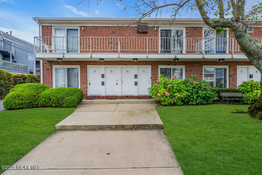 114 3rd Avenue, Unit 8 Belmar, NJ 07719 - Photo 3 of 13 a front view of a house with garden