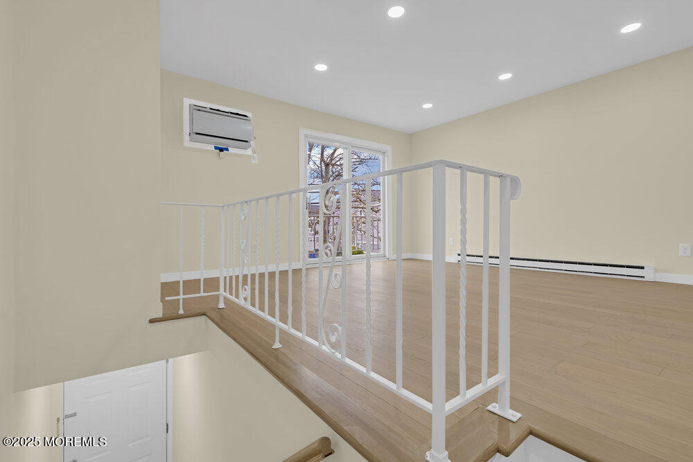 114 3rd Avenue, Unit 8 Belmar, NJ 07719 - Photo 4 of 13 a view of staircase with white walls