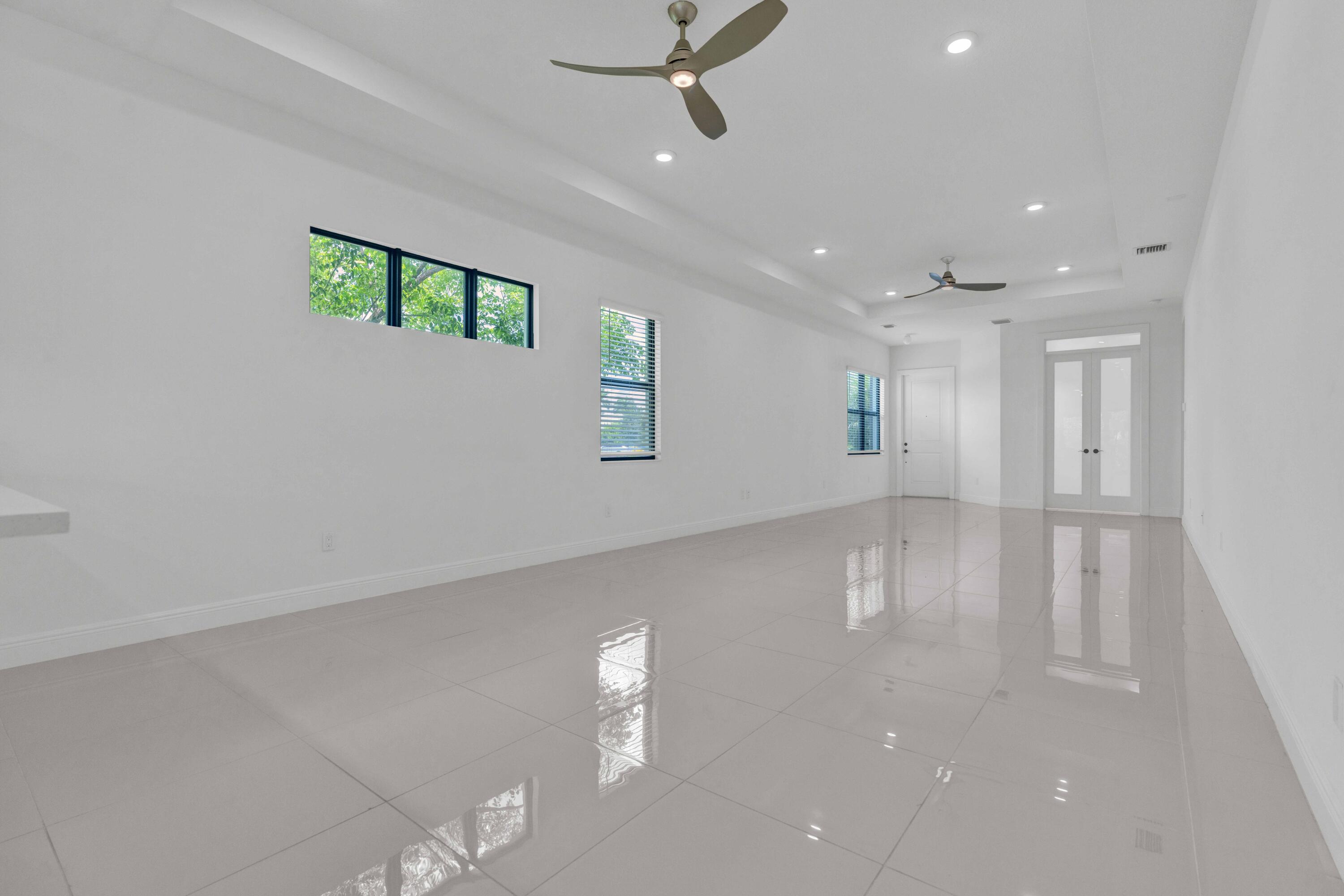 5501 Santa Rosa Lane Westlake, FL 33470 - Photo 4 of 31 a view of an empty room with a window