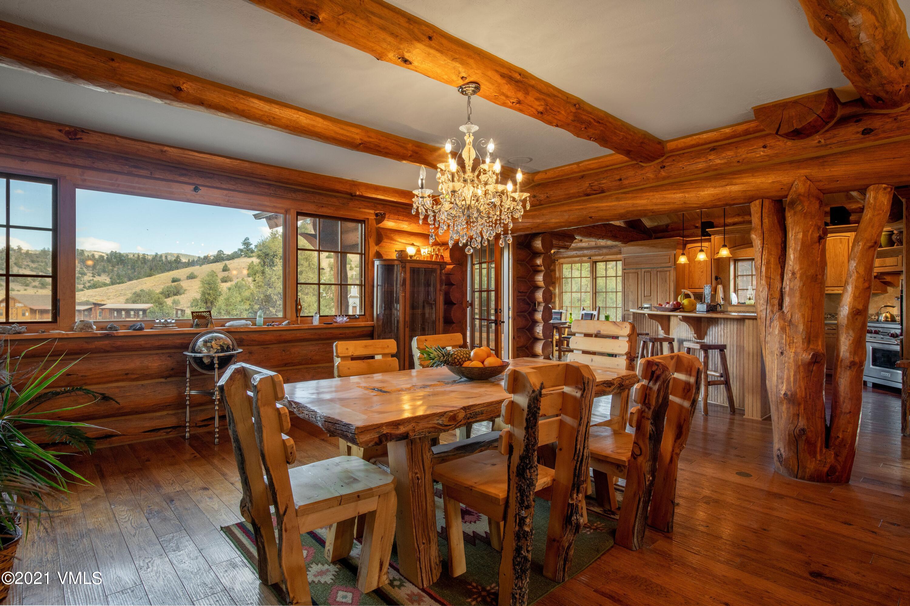 36710 County Rd CC 36 Saguache, CO 81149 - Photo 16 of 23 a view of a dining room with furniture window and wooden floor