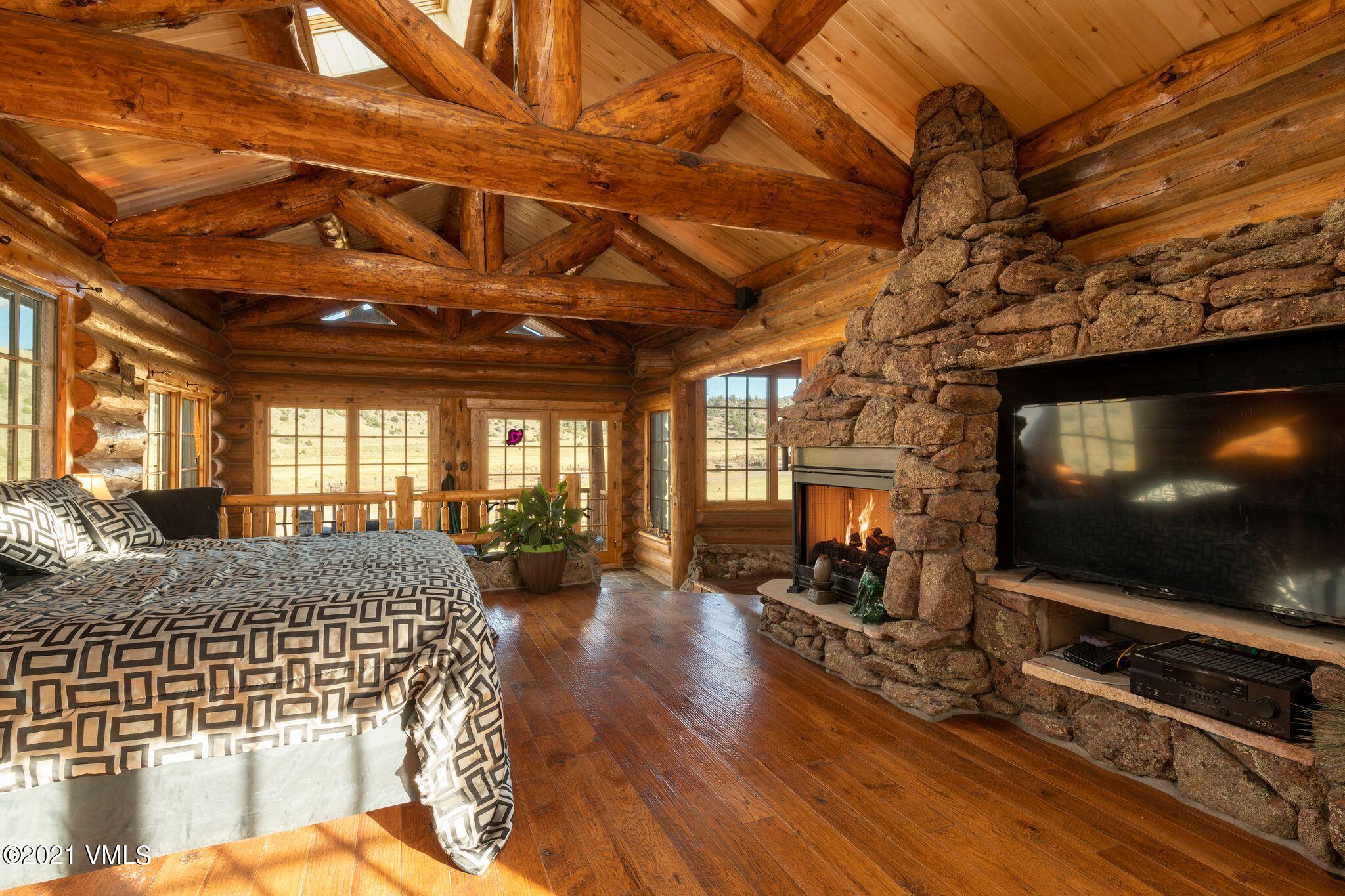 36710 County Rd CC 36 Saguache, CO 81149 - Photo 18 of 23 a bedroom with furniture and a flat screen tv