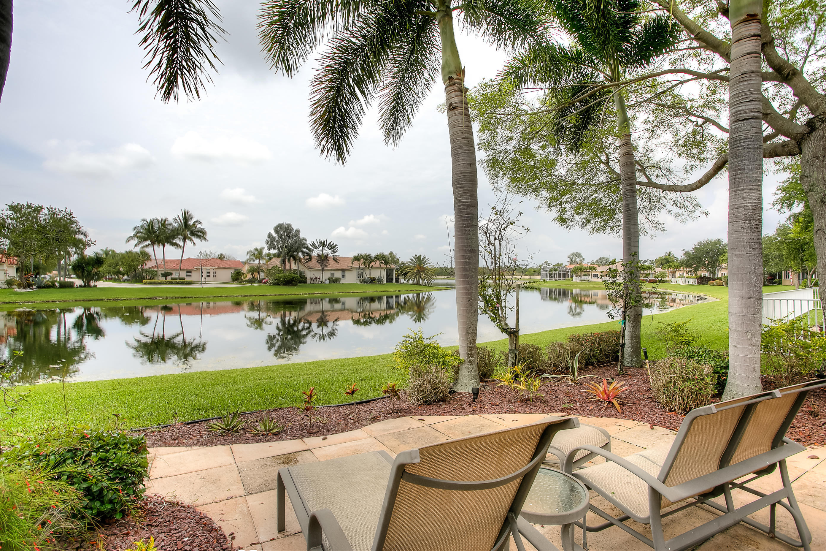 9748 Via Verga Street Lake Worth, FL 33467 - Photo 15 of 16 a view of swimming pool with a lake view