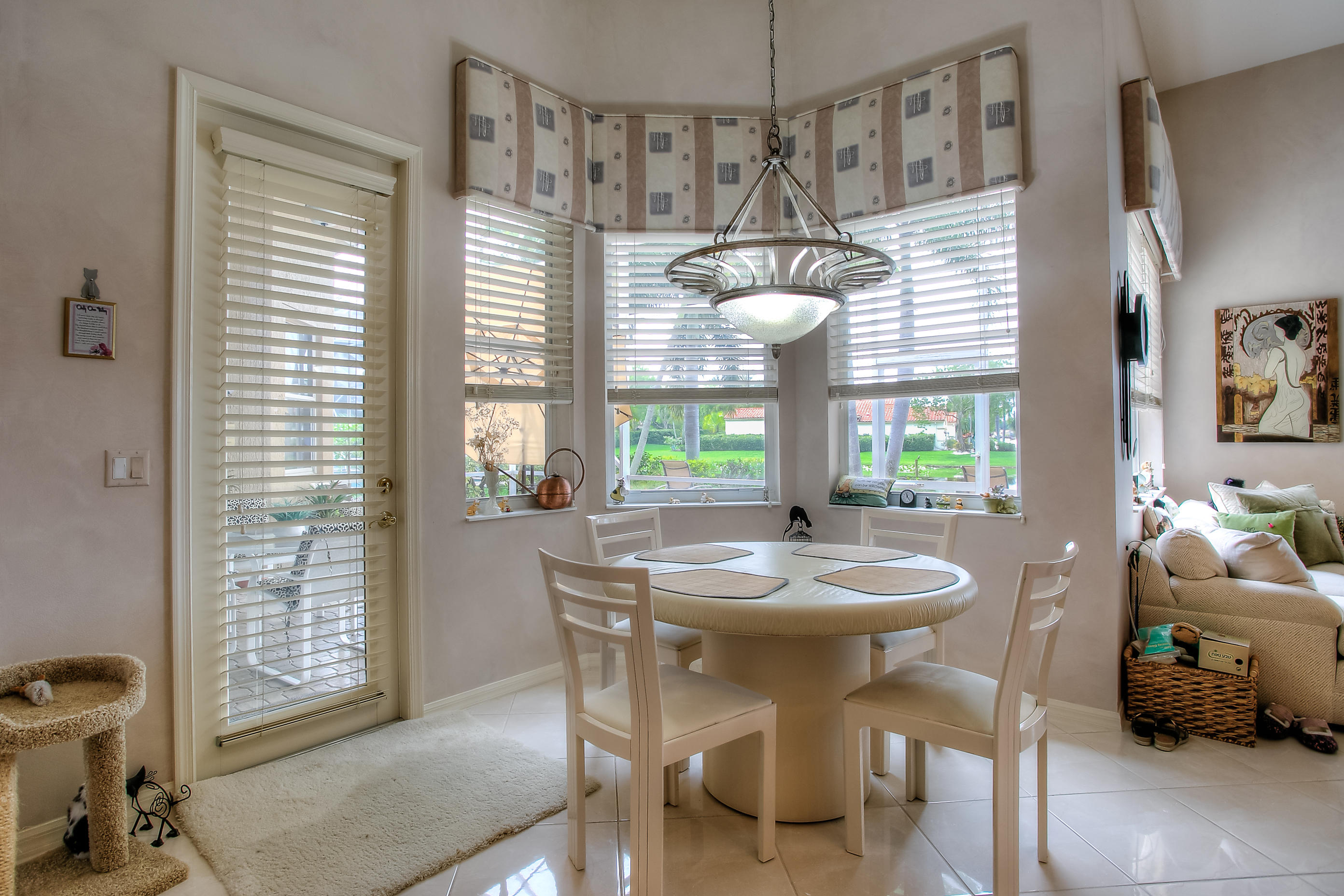 9748 Via Verga Street Lake Worth, FL 33467 - Photo 6 of 16 a dining room with furniture and window