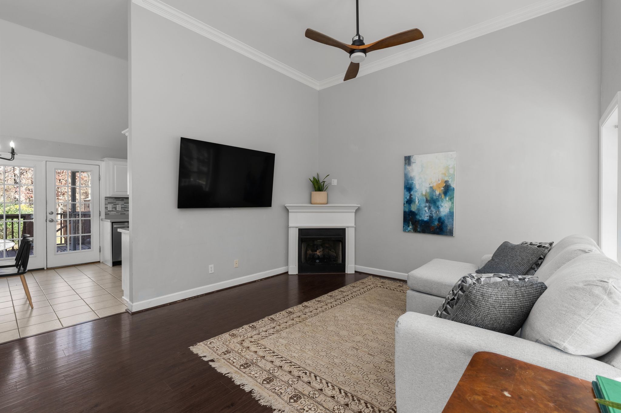 1283 Garton Road Burns, TN 37029 - Photo 6 of 28 a living room with furniture a fireplace and a flat screen tv