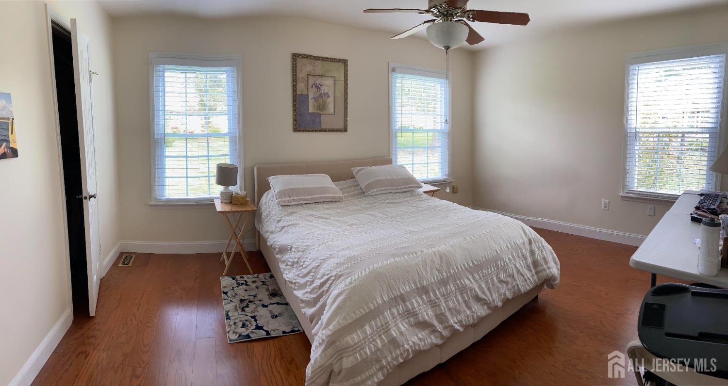 8 Benjamin Franklin Drive, Unit C Monroe Township, NJ 08831 - Photo 4 of 9 a bedroom with bed and a window